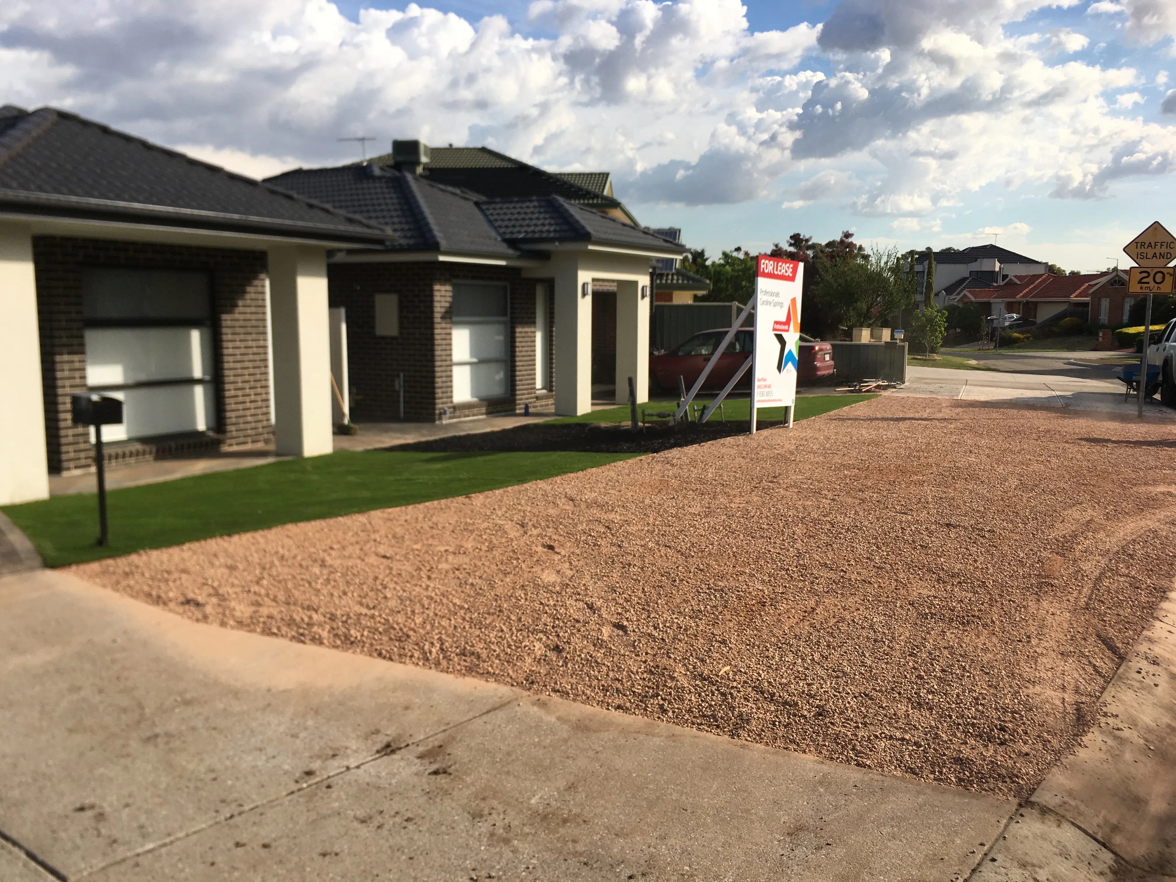 Modern Australian Duplex: Low-Maintenance Gravel & Turf Front Yard